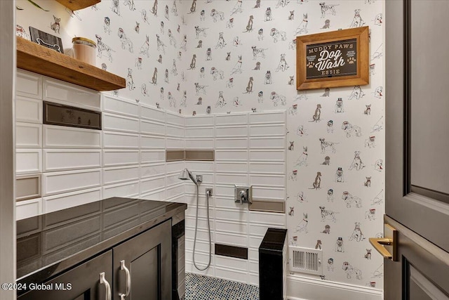 kitchen with wallpapered walls and open shelves