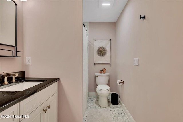 full bathroom featuring tile patterned floors, baseboards, toilet, and vanity