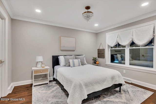 bedroom with recessed lighting, ornamental molding, baseboards, and wood finished floors