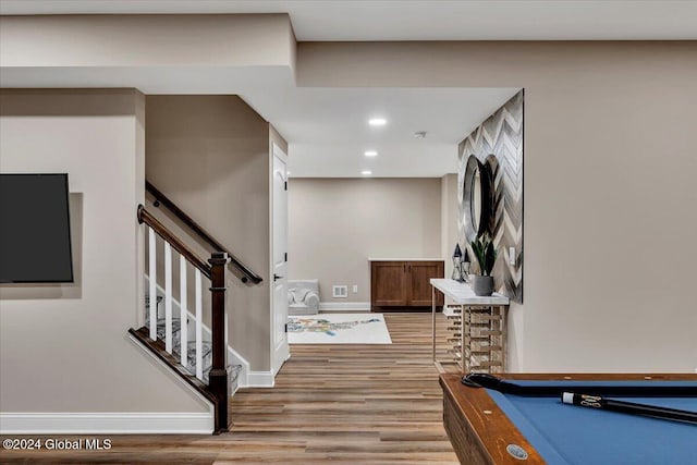 interior space with light wood finished floors, pool table, baseboards, stairway, and recessed lighting