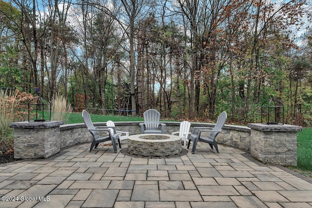 view of patio / terrace featuring an outdoor fire pit