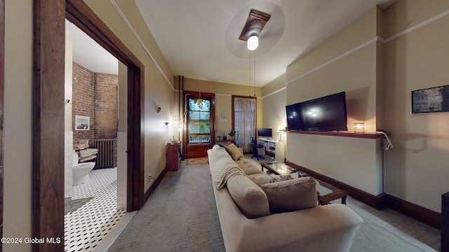 carpeted living room featuring ceiling fan