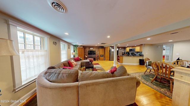 living room with light hardwood / wood-style floors