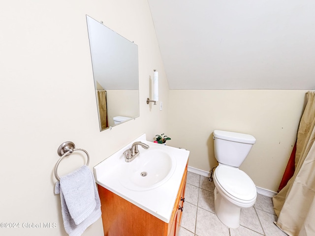 bathroom with lofted ceiling, tile patterned floors, vanity, and toilet