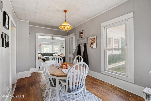 dining area with ornamental molding, hardwood / wood-style floors, and ceiling fan