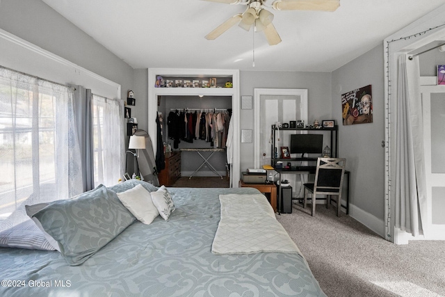 bedroom featuring ceiling fan, a closet, and carpet