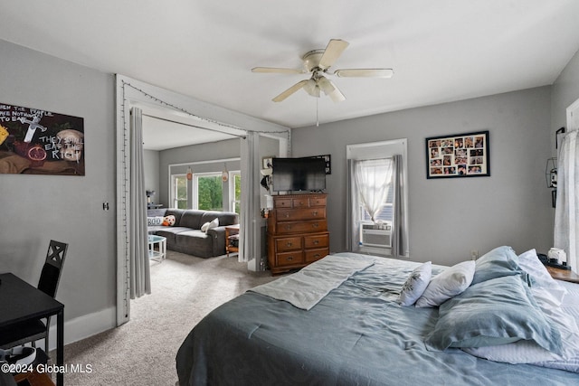 bedroom with ceiling fan, cooling unit, and carpet flooring