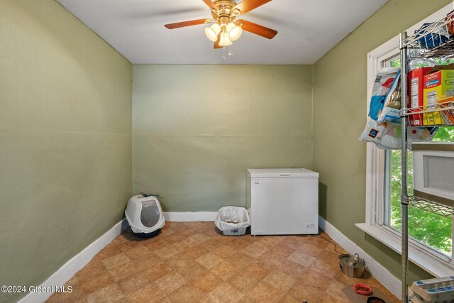 laundry room with ceiling fan and plenty of natural light