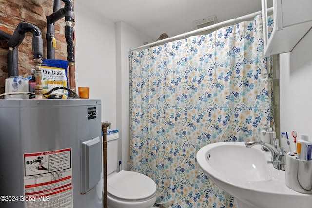 bathroom featuring sink, toilet, curtained shower, and electric water heater