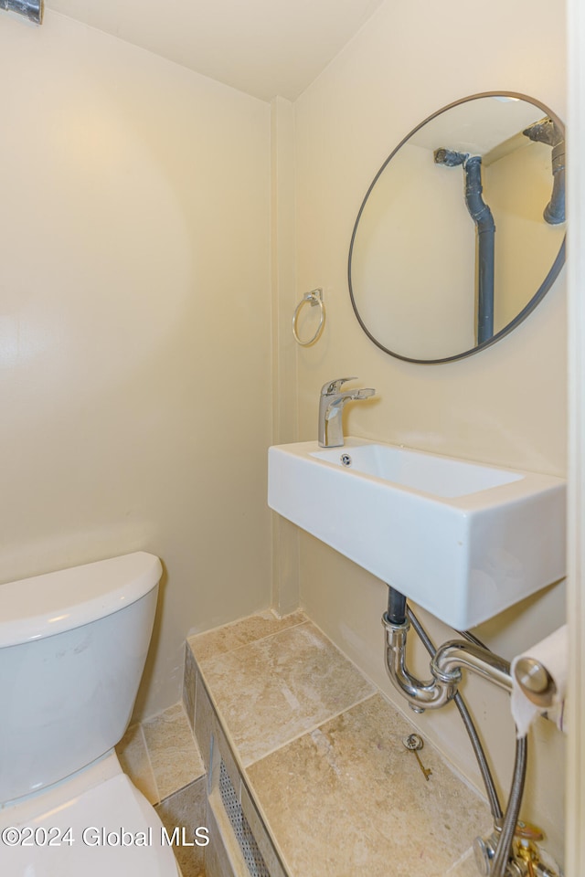 bathroom with sink and toilet