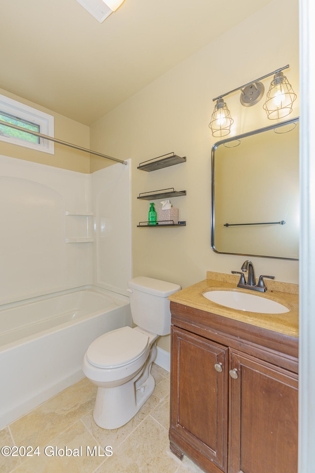 full bathroom featuring tile patterned floors, shower / washtub combination, vanity, and toilet