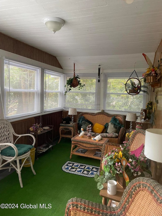 sunroom featuring a wealth of natural light and vaulted ceiling