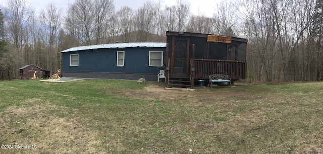 view of outbuilding featuring a lawn