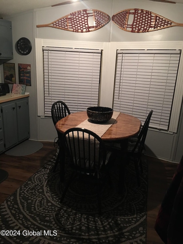 dining area with dark hardwood / wood-style floors