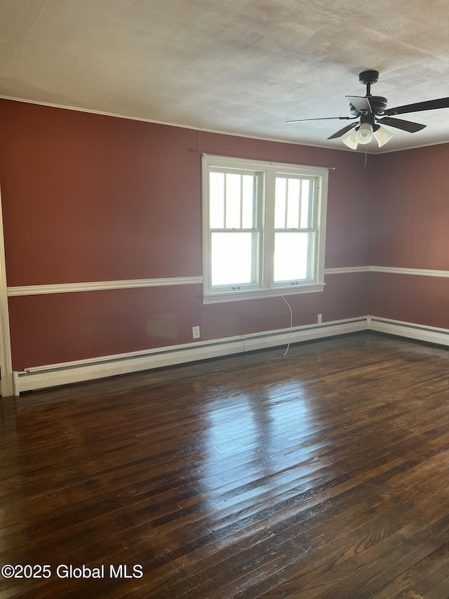 spare room with ceiling fan, a textured ceiling, and dark hardwood / wood-style floors