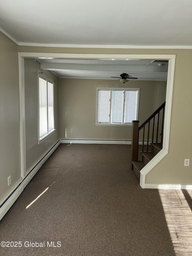 spare room with ceiling fan and dark carpet