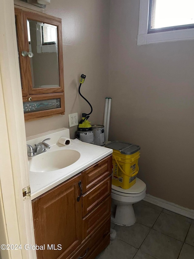 bathroom featuring tile patterned floors, toilet, and vanity