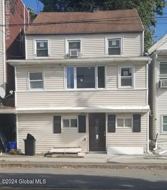 view of front of house featuring cooling unit