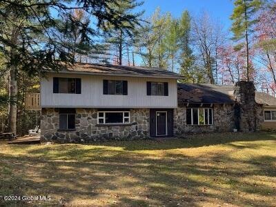 split level home with a front yard