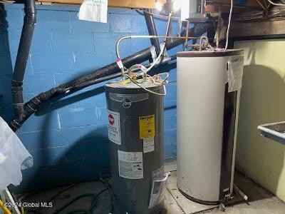 utilities featuring electric water heater and gas water heater