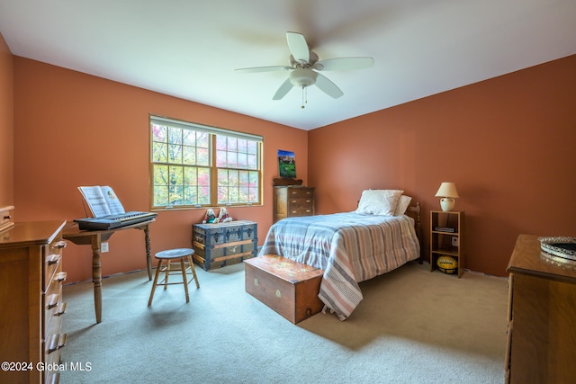 carpeted bedroom featuring ceiling fan