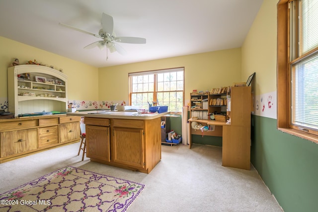 office with a wealth of natural light, ceiling fan, and light colored carpet