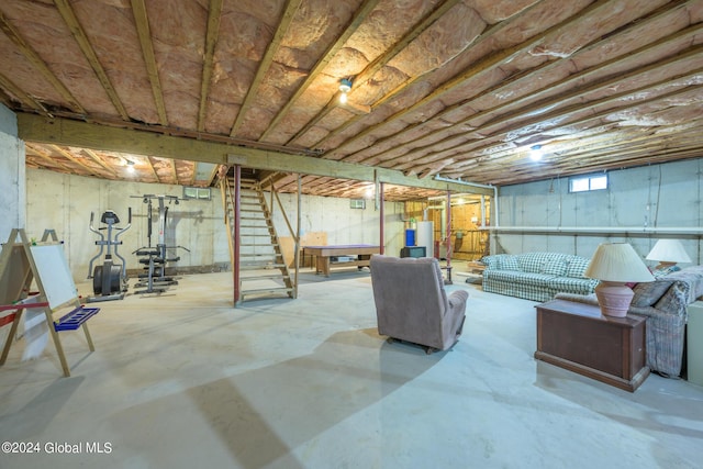 basement with stairway and water heater
