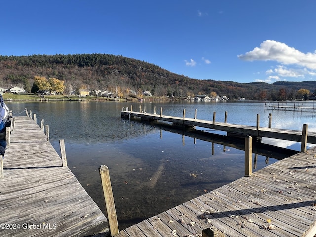 dock area featuring a water and mountain view