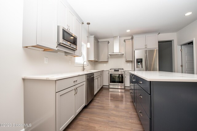 19 Hunter Ct, Milton, NY 12020 - kitchen featuring stainless steel appliances, wall chimney exhaust hood, gray cabinets, wood finished floors, and light countertops