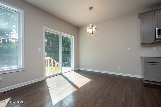 19 Hunter Ct, Milton, NY 12020 - unfurnished dining area with a chandelier, dark wood-style floors, and baseboards