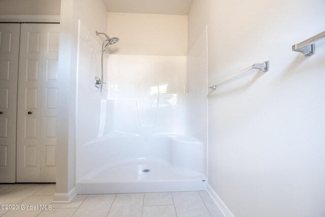19 Hunter Ct, Milton, NY 12020 - bathroom with tile patterned flooring, a shower, and baseboards