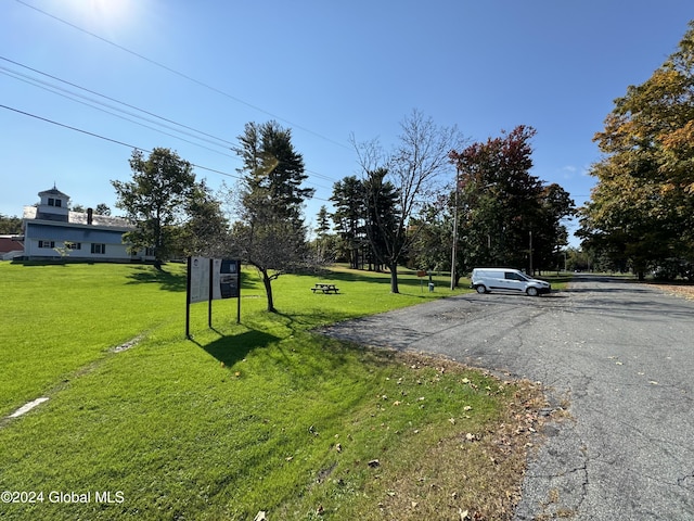 view of street with aphalt driveway