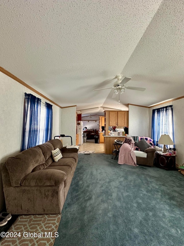 carpeted living room featuring ornamental molding, a textured ceiling, vaulted ceiling, and ceiling fan