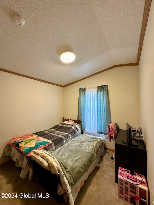 bedroom featuring a textured ceiling, light carpet, vaulted ceiling, and ornamental molding