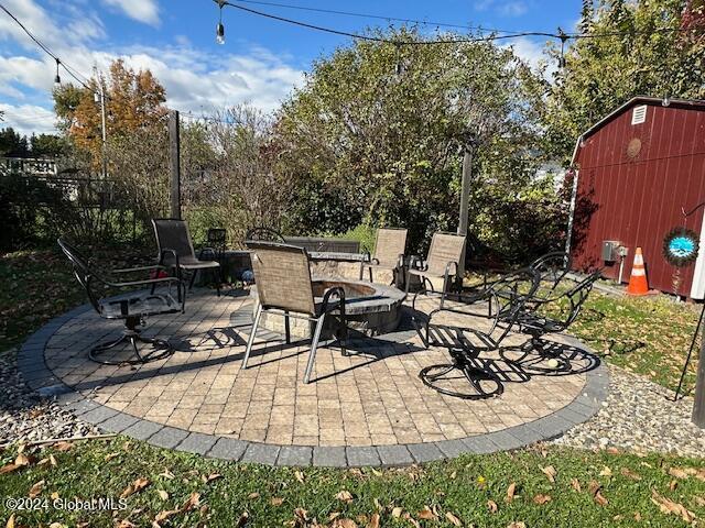 view of patio with a storage unit