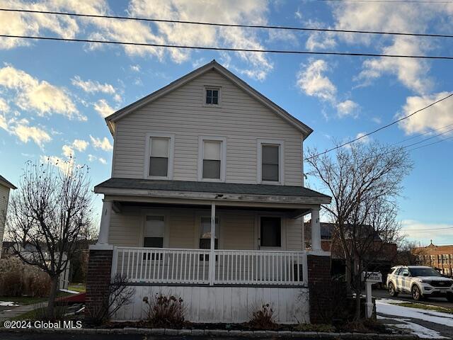 view of property with a porch