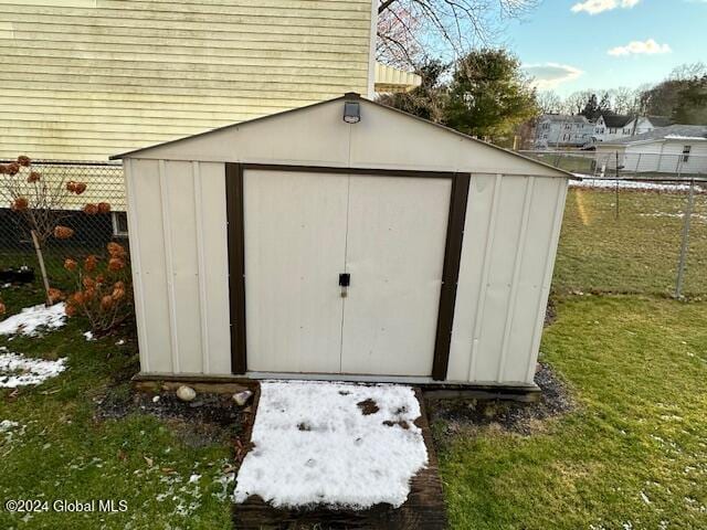 view of outdoor structure with a lawn