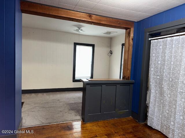 empty room with dark hardwood / wood-style flooring