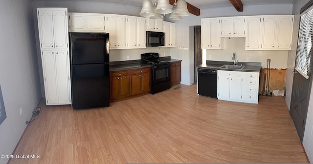 kitchen with sink, beam ceiling, black appliances, and white cabinets