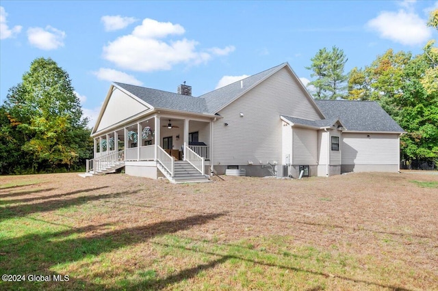 back of property featuring a yard, covered porch, and ceiling fan