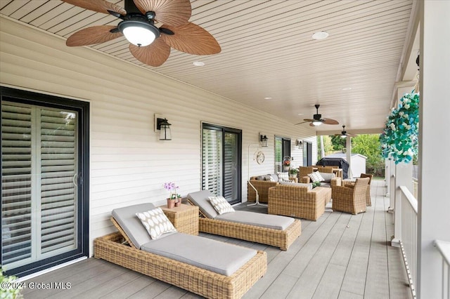 deck featuring an outdoor hangout area and ceiling fan