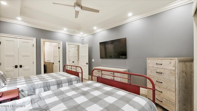 bedroom featuring ornamental molding, a closet, and ceiling fan