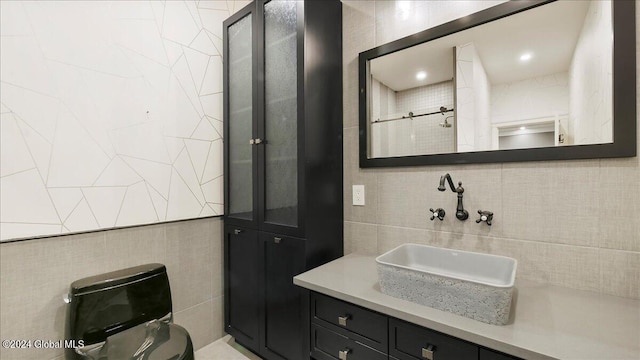 bathroom featuring decorative backsplash, walk in shower, tile walls, toilet, and vanity