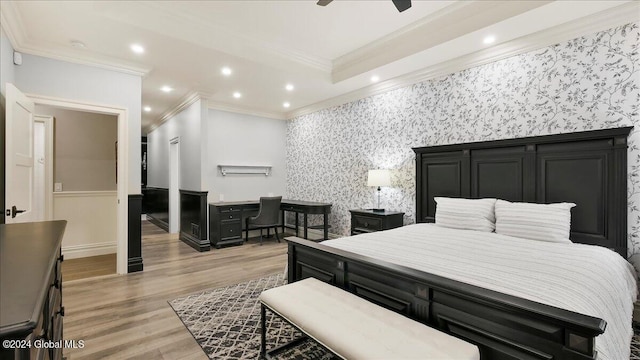 bedroom featuring crown molding, light wood-type flooring, and ceiling fan