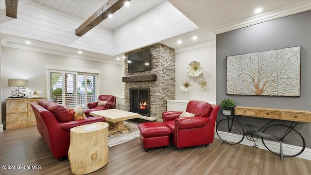 living room with a fireplace, hardwood / wood-style floors, wooden ceiling, beam ceiling, and ornamental molding