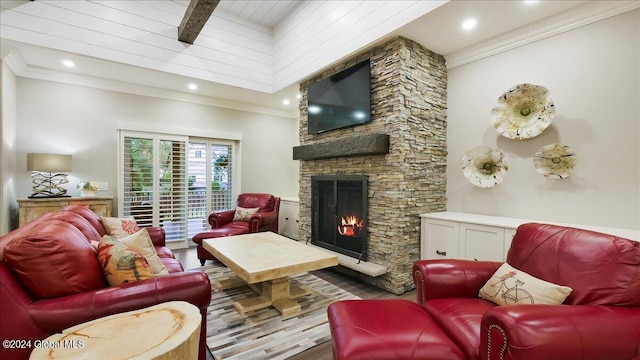 living room with a stone fireplace, crown molding, and light hardwood / wood-style floors