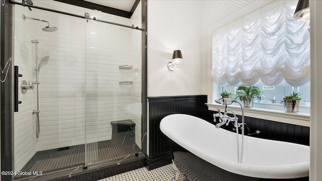 bathroom featuring separate shower and tub