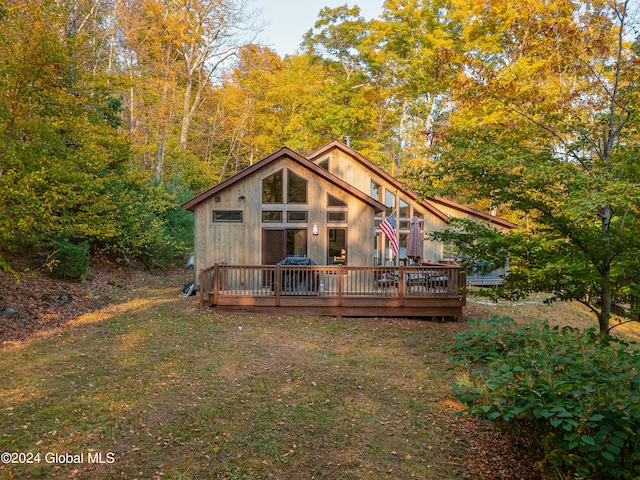 back of property featuring a deck