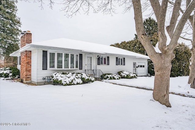 single story home featuring a garage