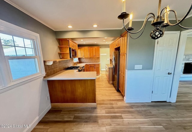 kitchen featuring tasteful backsplash, ornamental molding, kitchen peninsula, stainless steel appliances, and light hardwood / wood-style flooring